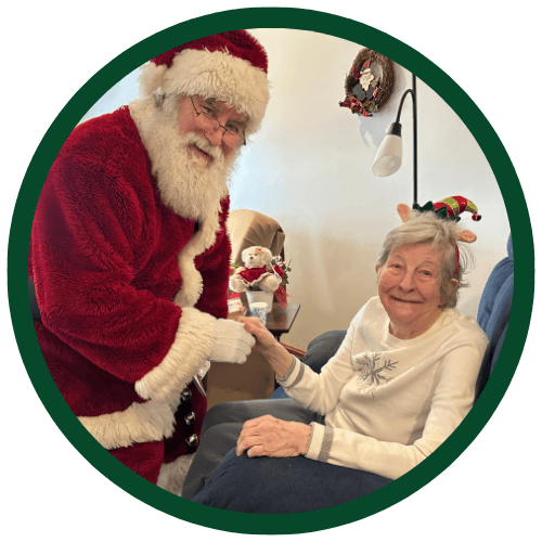 A Pine View resident sharing a holiday visit with Santa